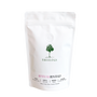 White coffee bag with 'Treelogy' branding on a white background
